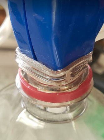 Softening The Neck Of Soda Bottle For Spray Guard